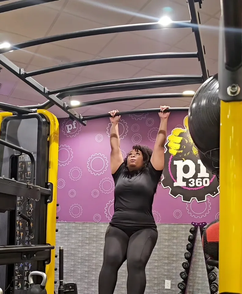 Client performing a hanging strength exercise